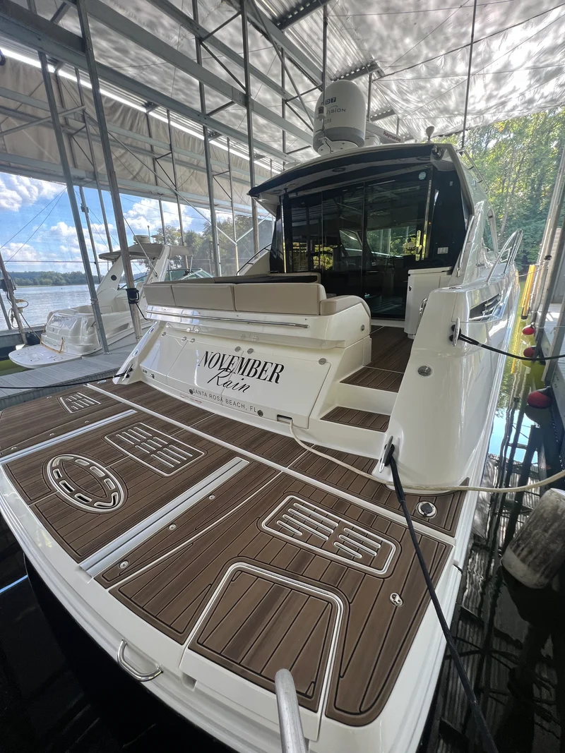 Teak GatorStep rear deck with name inlay on a cabin cruiser
