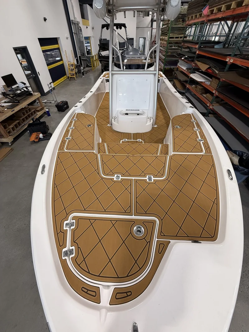 Tan diamond-pattern GatorStep bow decking on a center console boat