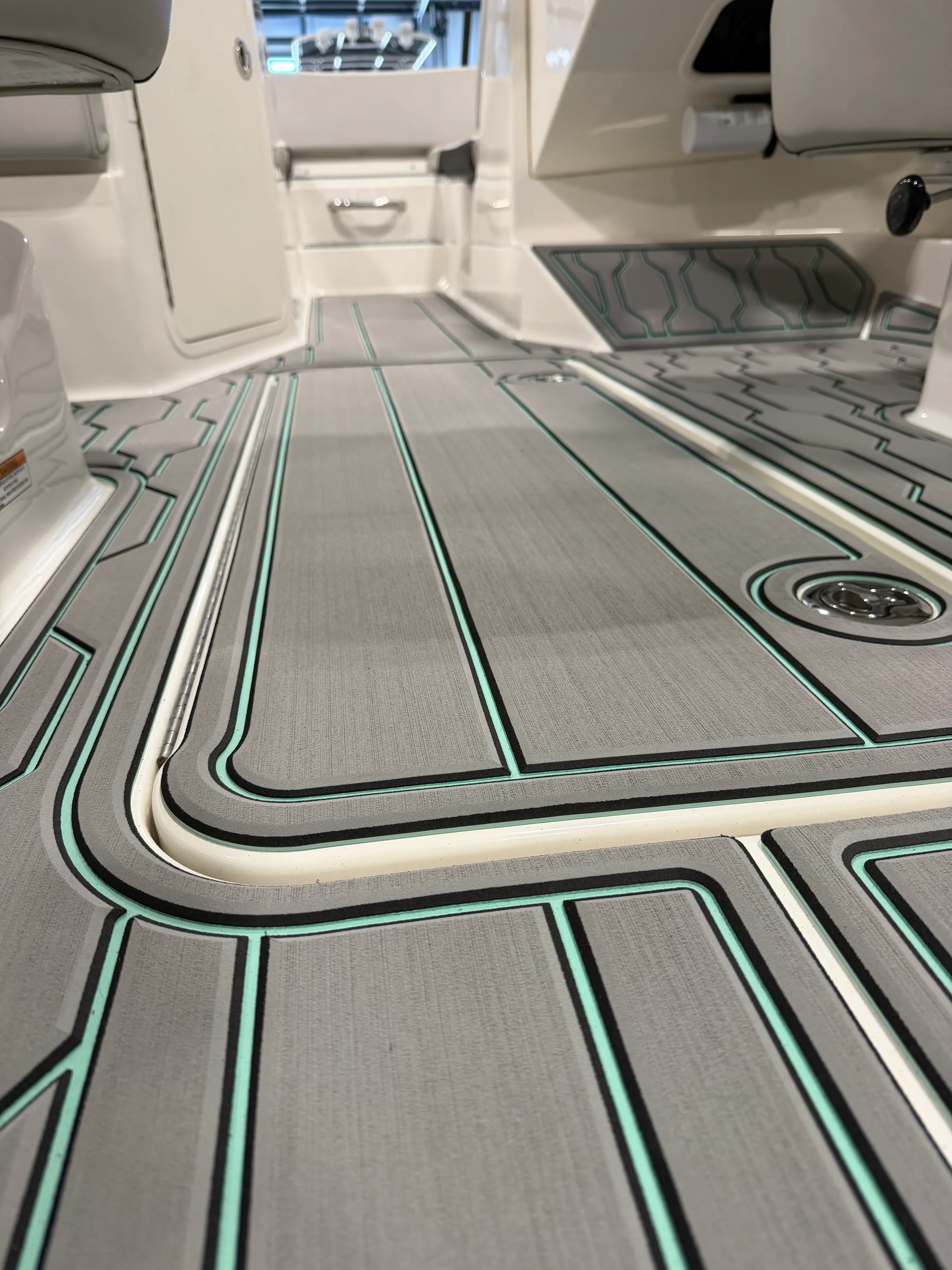 Gray GatorStep boat flooring with seafoam green accent lines in a boat cockpit — Knoxville, TN
