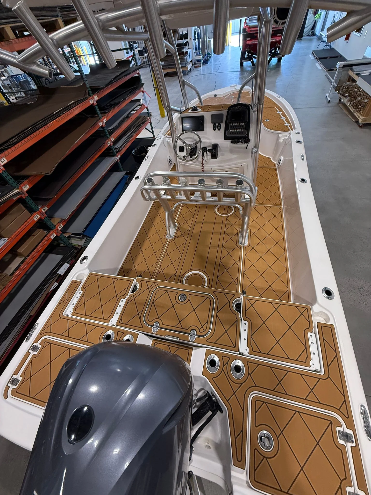 Custom tan diamond-pattern GatorStep EVA decking in a center console cockpit — Lakebound Marine