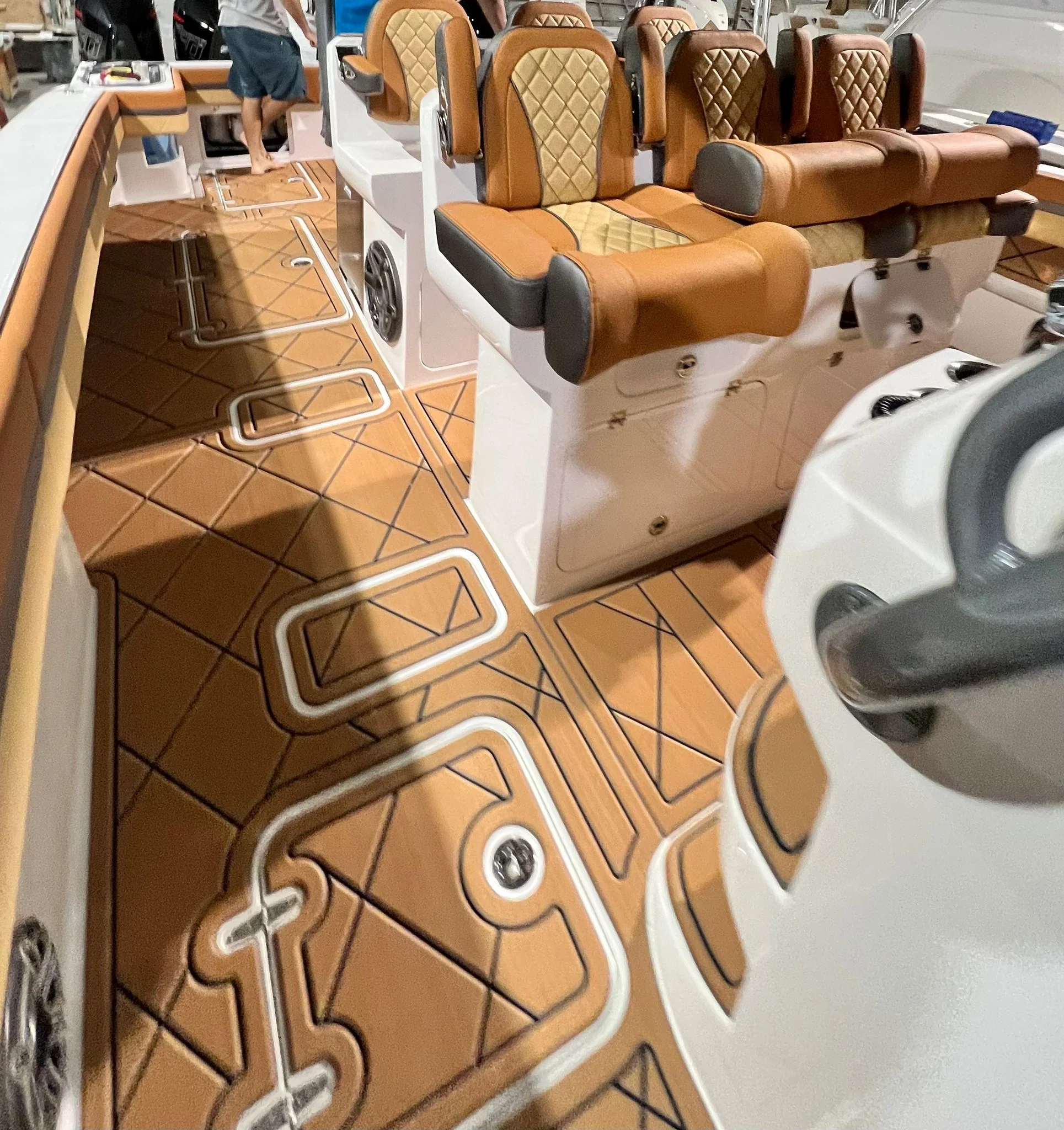 Custom GatorStep flooring, tan diamond pattern, in a center console cockpit — Lakebound Marine, Lenoir City TN