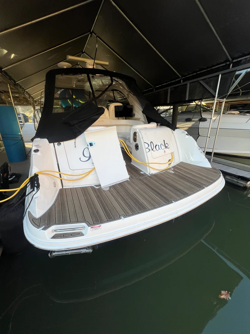 Brown teak GatorStep bow deck on a cruiser at the marina