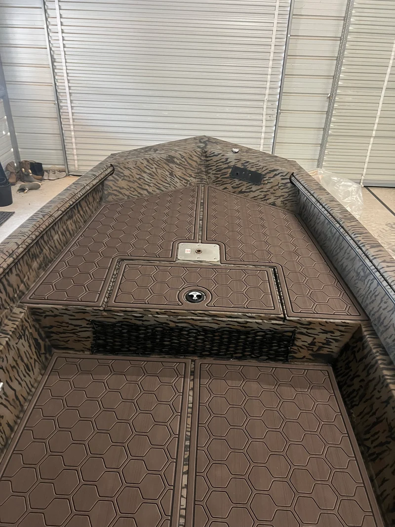 Brown GatorStep covering a bass boat deck and compartment lids