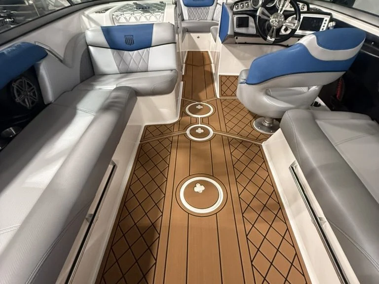 Brown teak GatorStep flooring with custom logo inlays in a MasterCraft wakeboat cockpit — Lakebound Marine, Knoxville TN