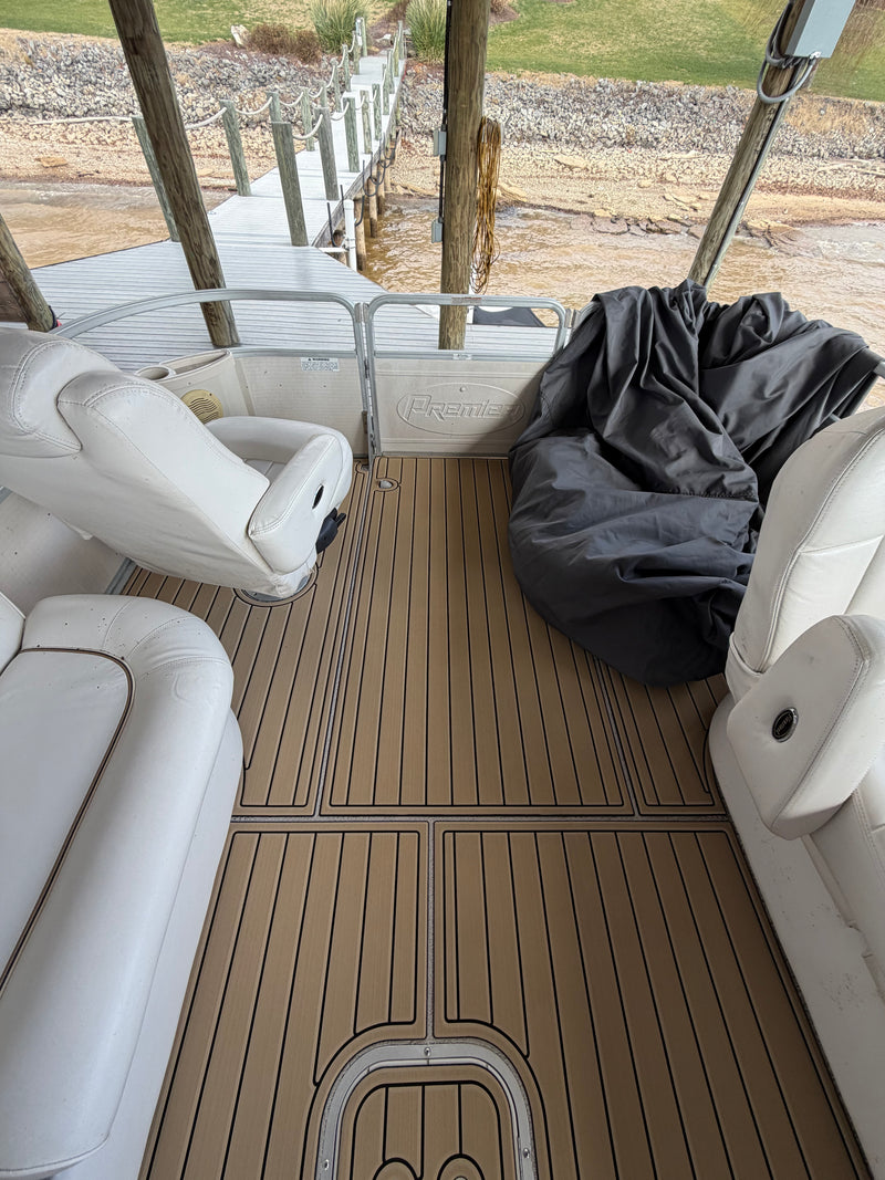 Tan teak GatorStep pontoon deck with white furniture at the dock