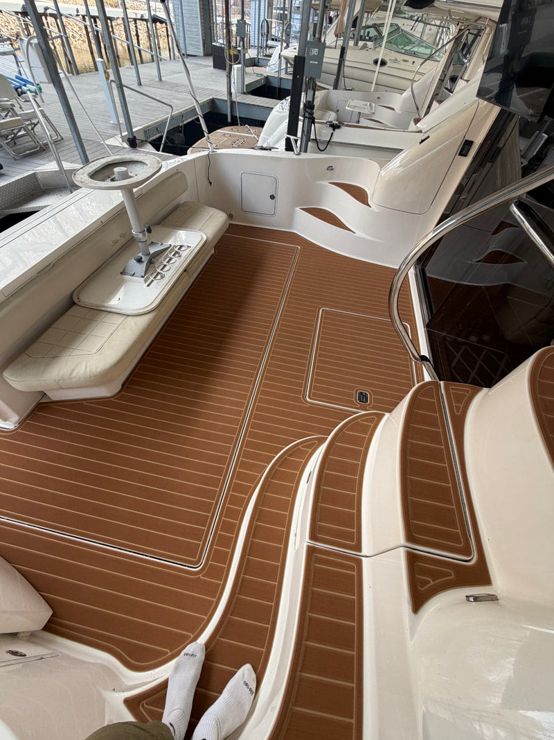 Tan teak-pattern GatorStep flooring in a deck boat cockpit