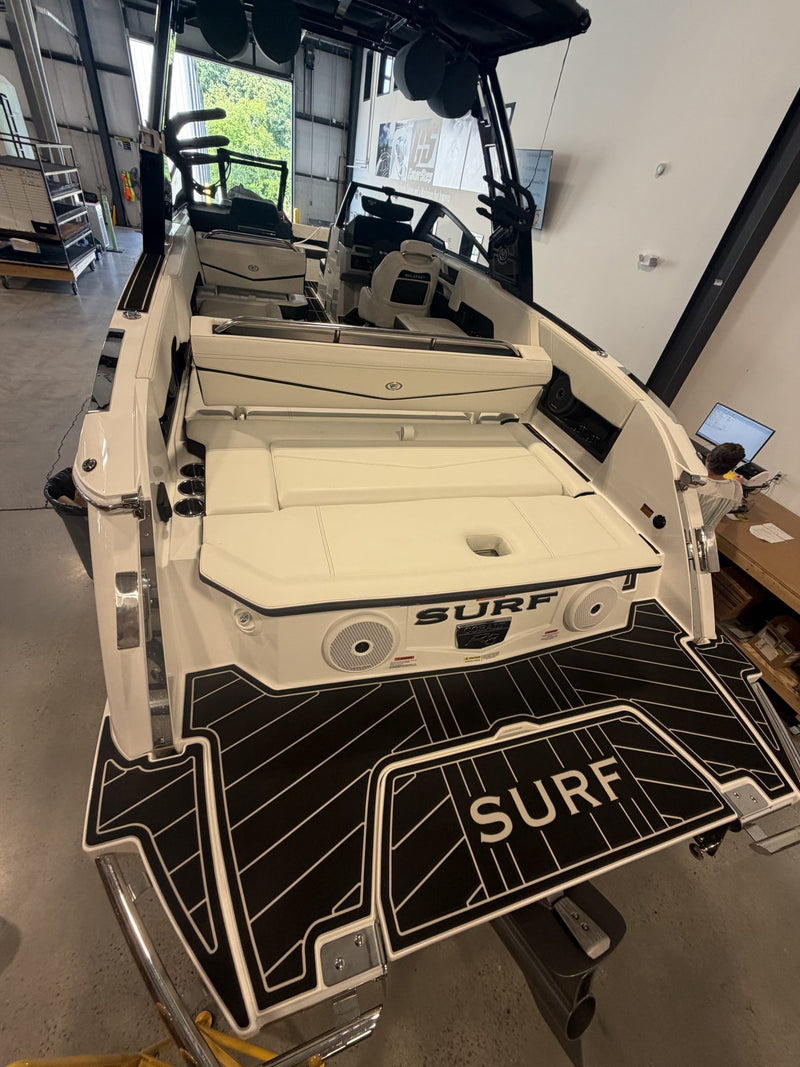 Tan GatorStep transom pads with Surf lettering on a wakeboat