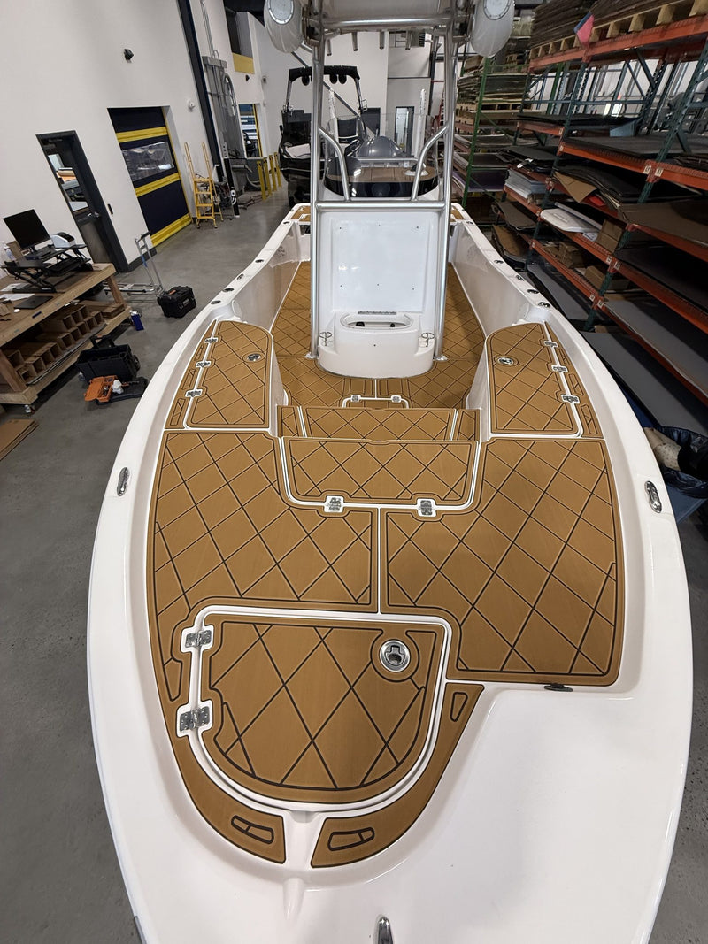 Tan diamond-pattern GatorStep bow decking on a center console boat