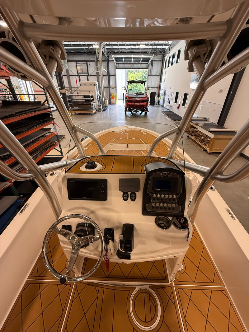 Teak GatorStep flooring at the helm of a center console boat