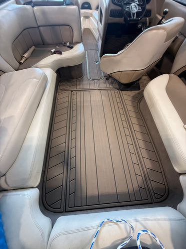 Dark teak GatorStep flooring on a pontoon rear lounge