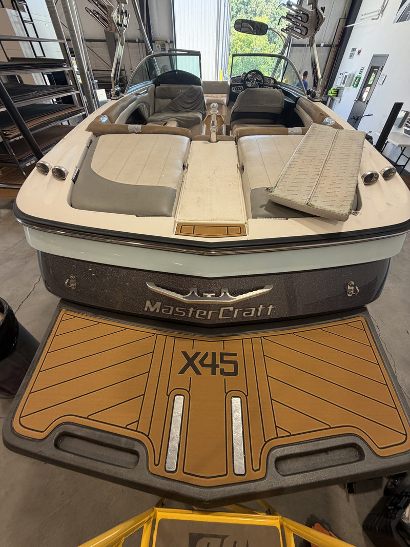 Tan GatorStep swim platform on a MasterCraft X45 wakeboat