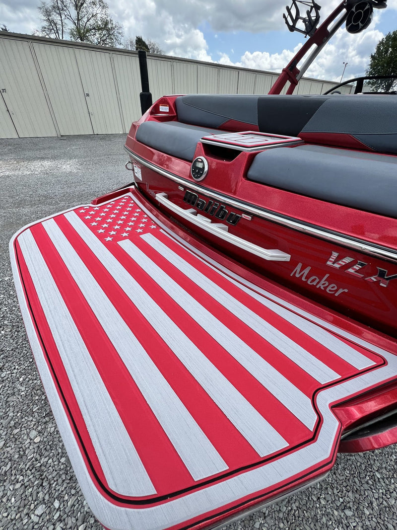 American flag GatorStep swim platform on a red wakeboat