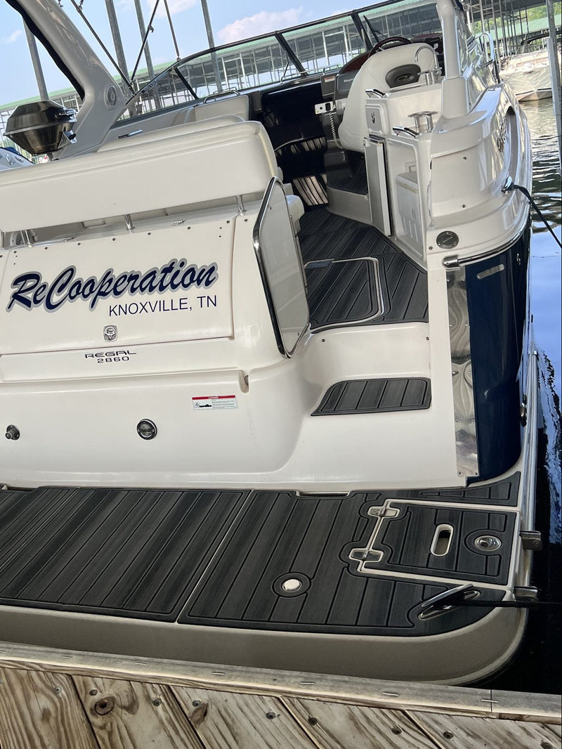 Teak GatorStep swim platform on a dark-hulled cruiser from Knoxville, TN