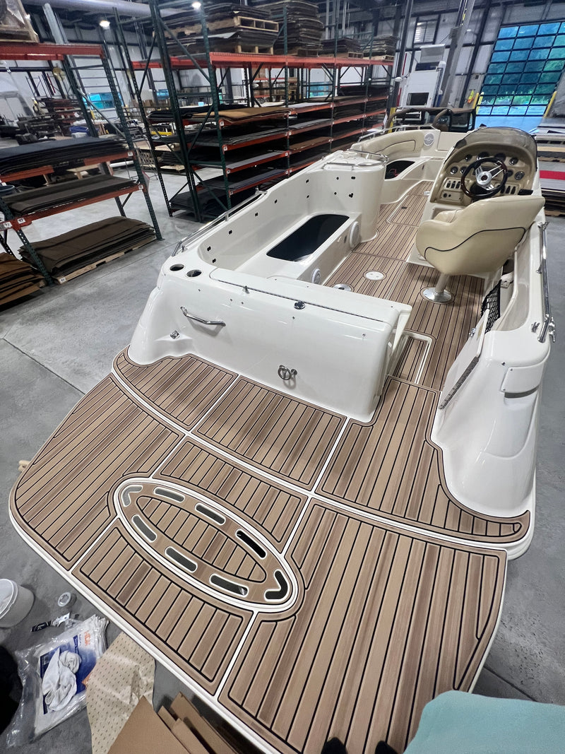 Curved teak GatorStep swim platform and rear deck on a cabin cruiser