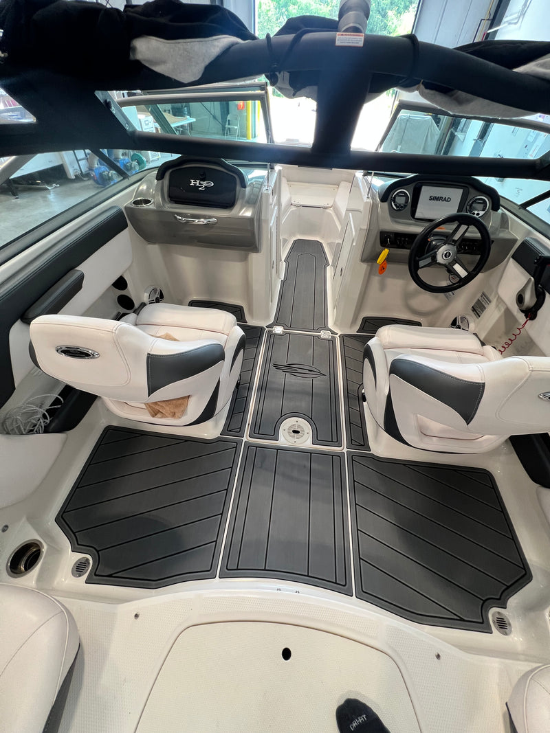 Dark teak GatorStep cockpit flooring in a bowrider