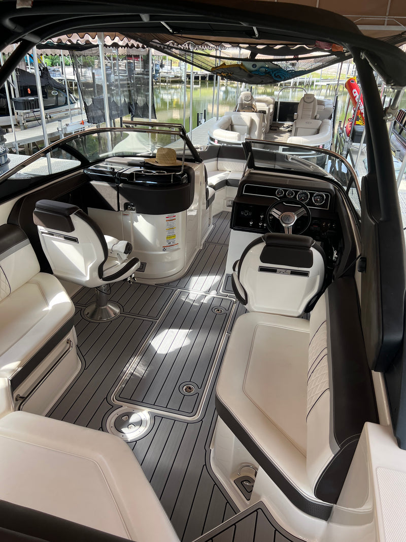 Gray teak GatorStep cockpit flooring in a black and white wakeboat