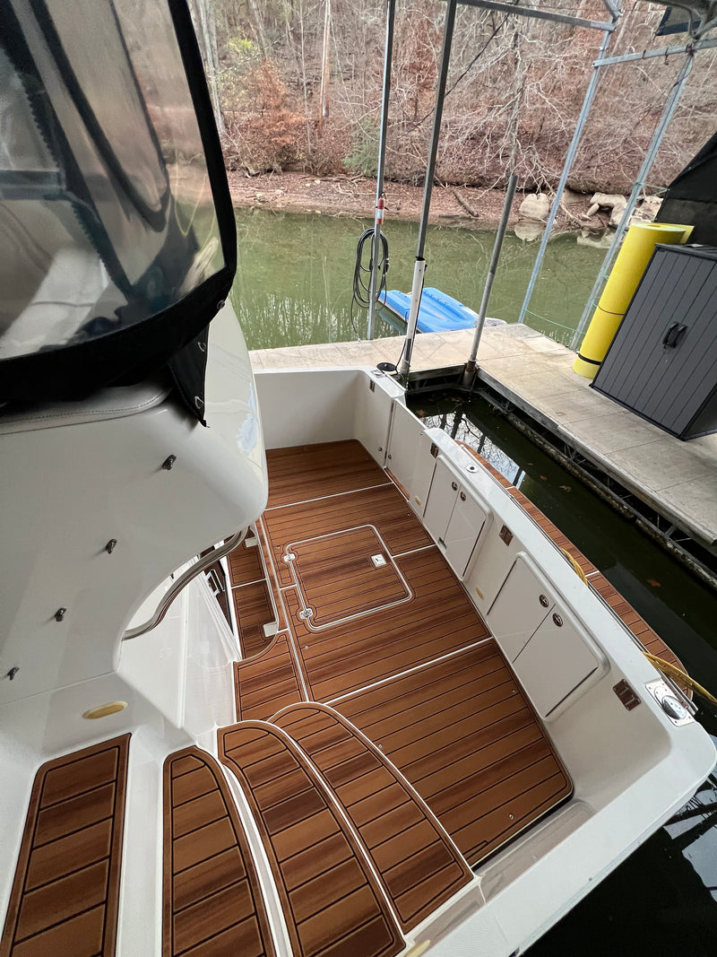 Teak GatorStep walkway flooring in a white boat cockpit