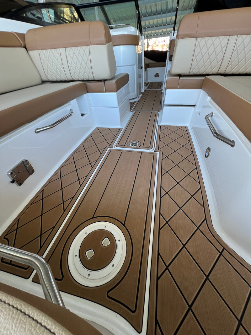 Brown teak GatorStep bow deck with hatch on a cruiser