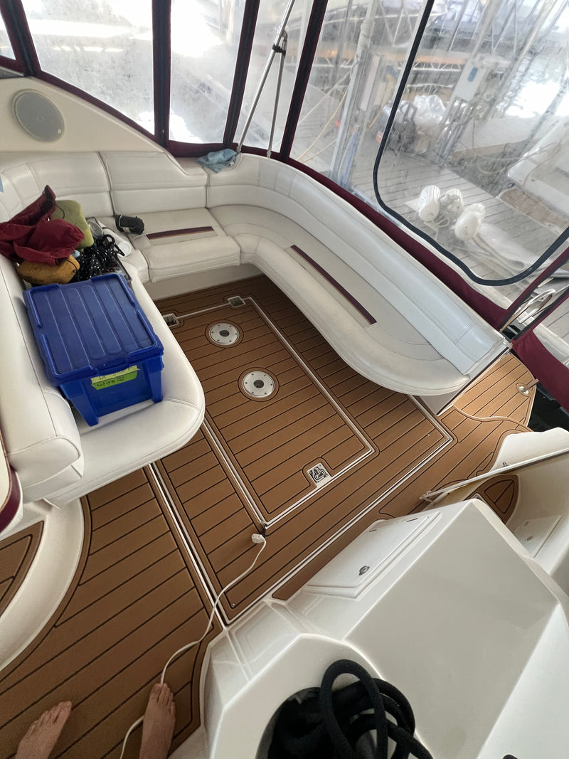 Tan teak GatorStep cockpit floor in a bowrider with cooler