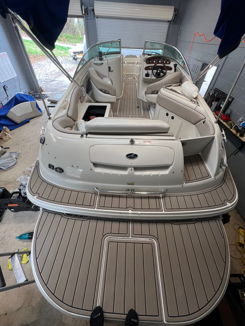 Tan teak GatorStep swim platform on a white bowrider stern