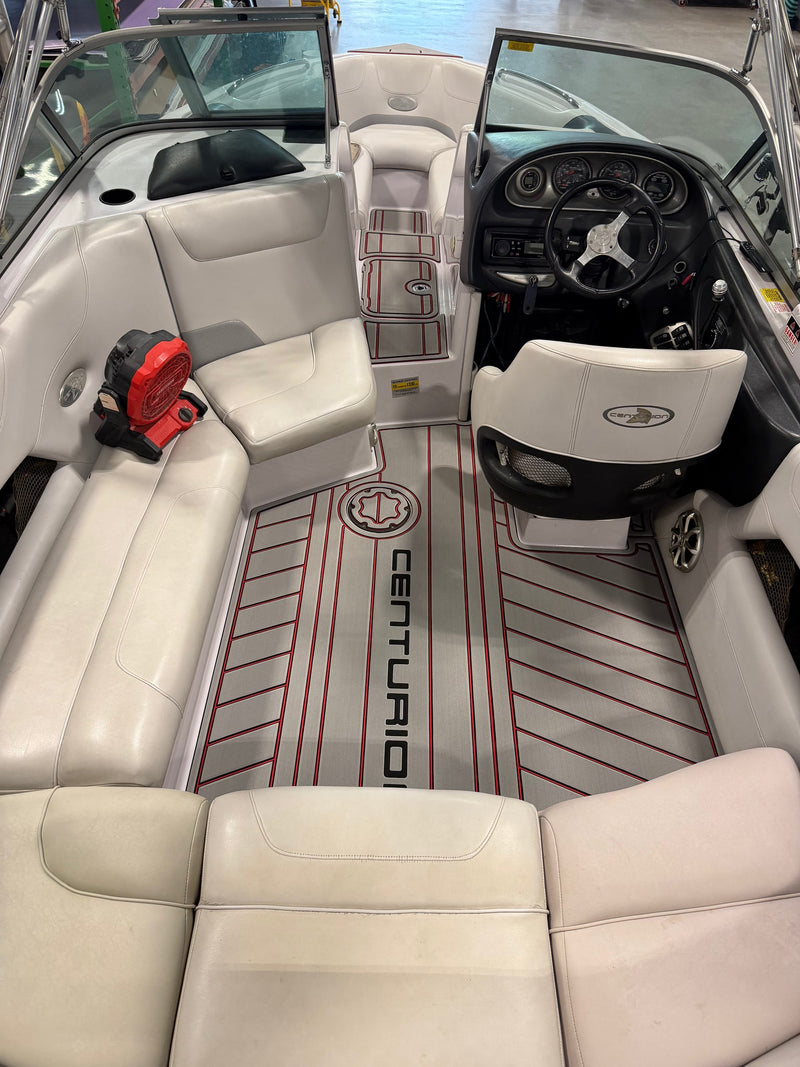 After: custom-fit GatorStep flooring with logo inlay installed in a Centurion wakeboat cockpit — Lakebound Marine, Lenoir City TN